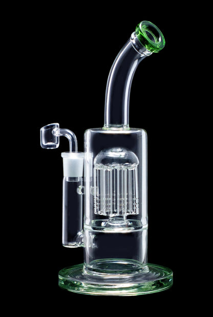 Clear glass water pipe (bong) with intricate percolator filtration system, isolated on black.