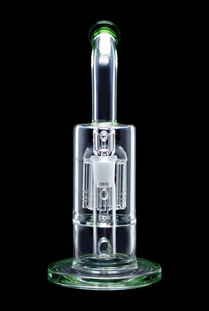 Clear glass dab rig with intricate percolators, isolated on a black background.