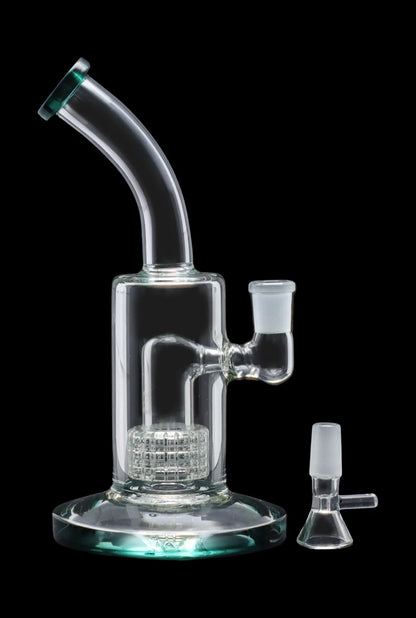Clear glass bubbler water pipe with an intricate honeycomb perc diffusion system and accompanying glass bowl.