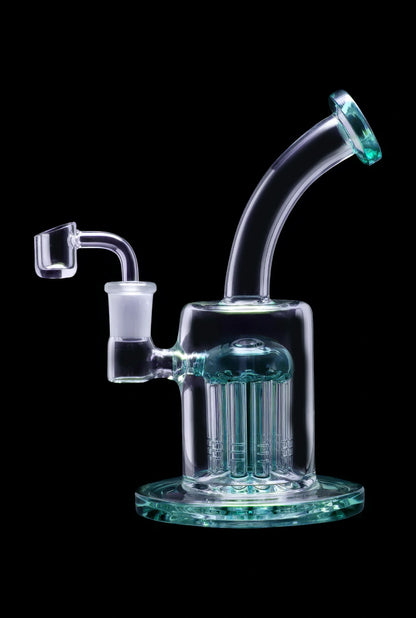 Light blue glass rig with multiple diffusion stems and a quartz banger.