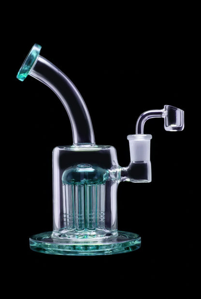 Glass dab rig with multiple diffusion towers, isolated on a black background.