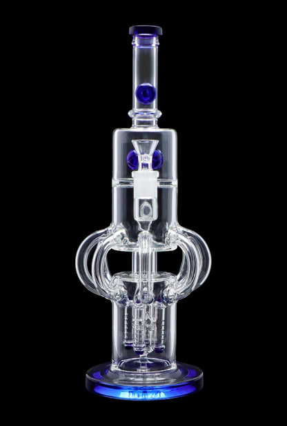 Clear glass water pipe (rig) with intricate perc filtration system and blue accents, isolated on black.