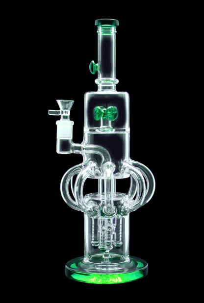 A glowing green glass water pipe (bong) with intricate percolators and a bowl piece, isolated on a black background.