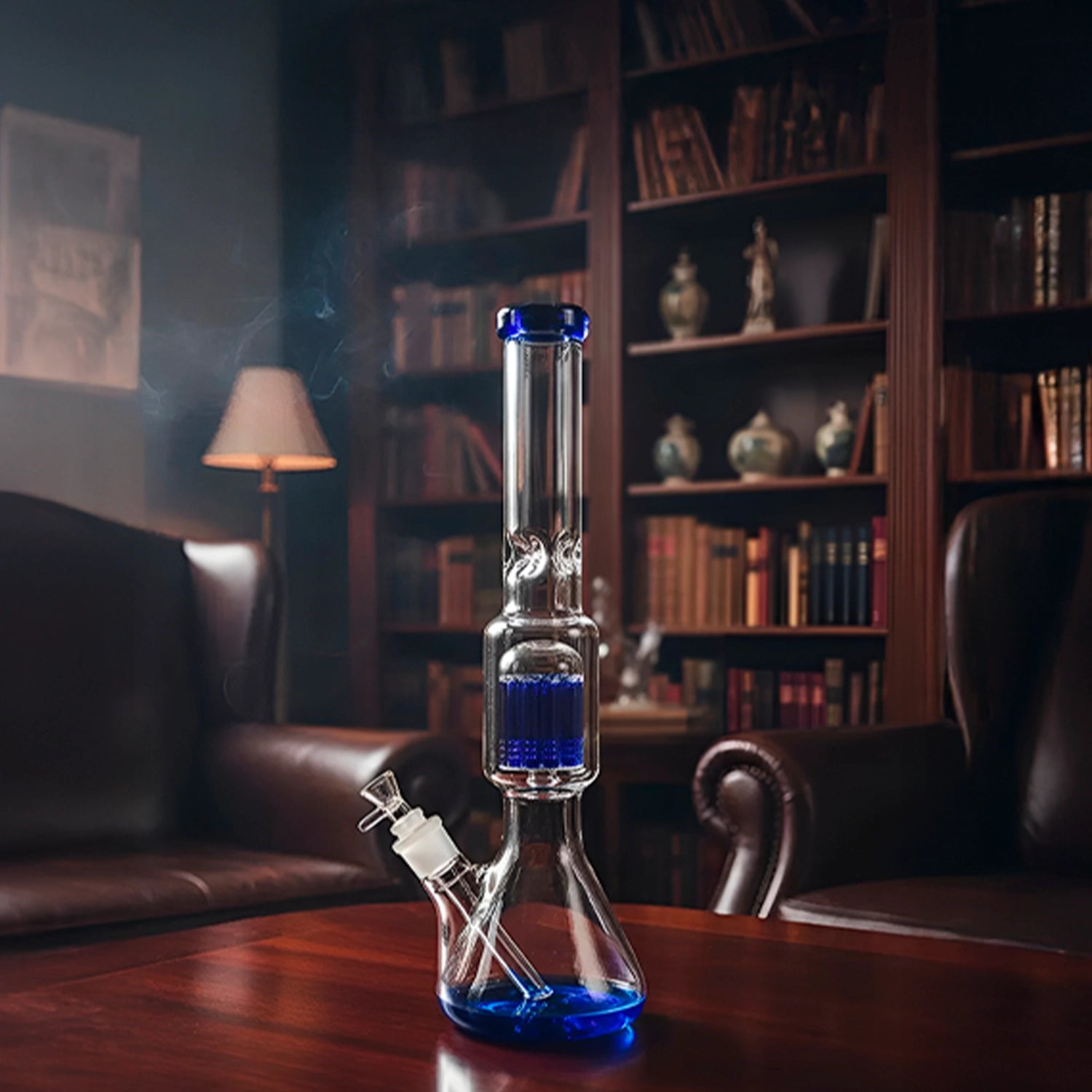Centered front view of the Smoke Cartel 9mm Beaker w/ Tree Perc Bong - 18 in., clear glass with blue accents on a wooden table.