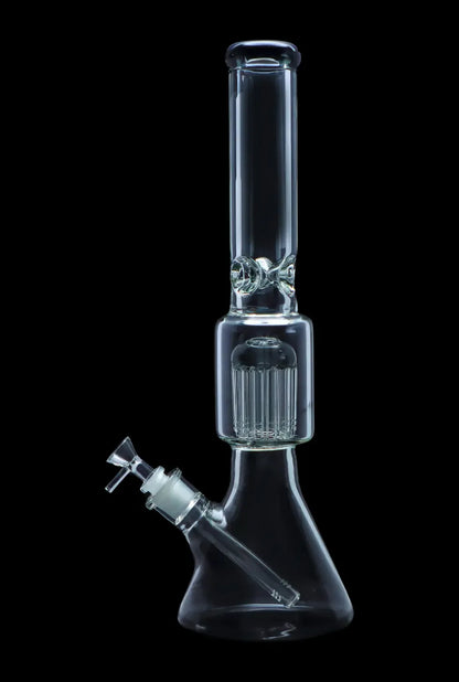 Clear glass bong with a percolator, isolated on a black background.