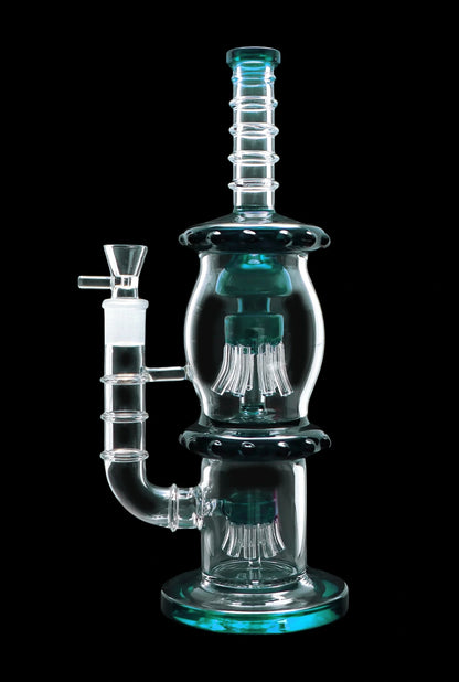 A studio shot of the 13.5-inch Smoke Cartel Straight Tube with Dual Octopus Perc, showcasing its clear glass construction and intricate perc design.