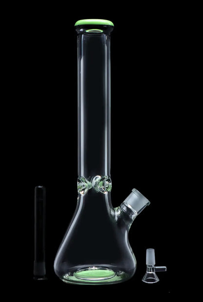 Clear glass bong with green accents, alongside a downstem and glass filter.