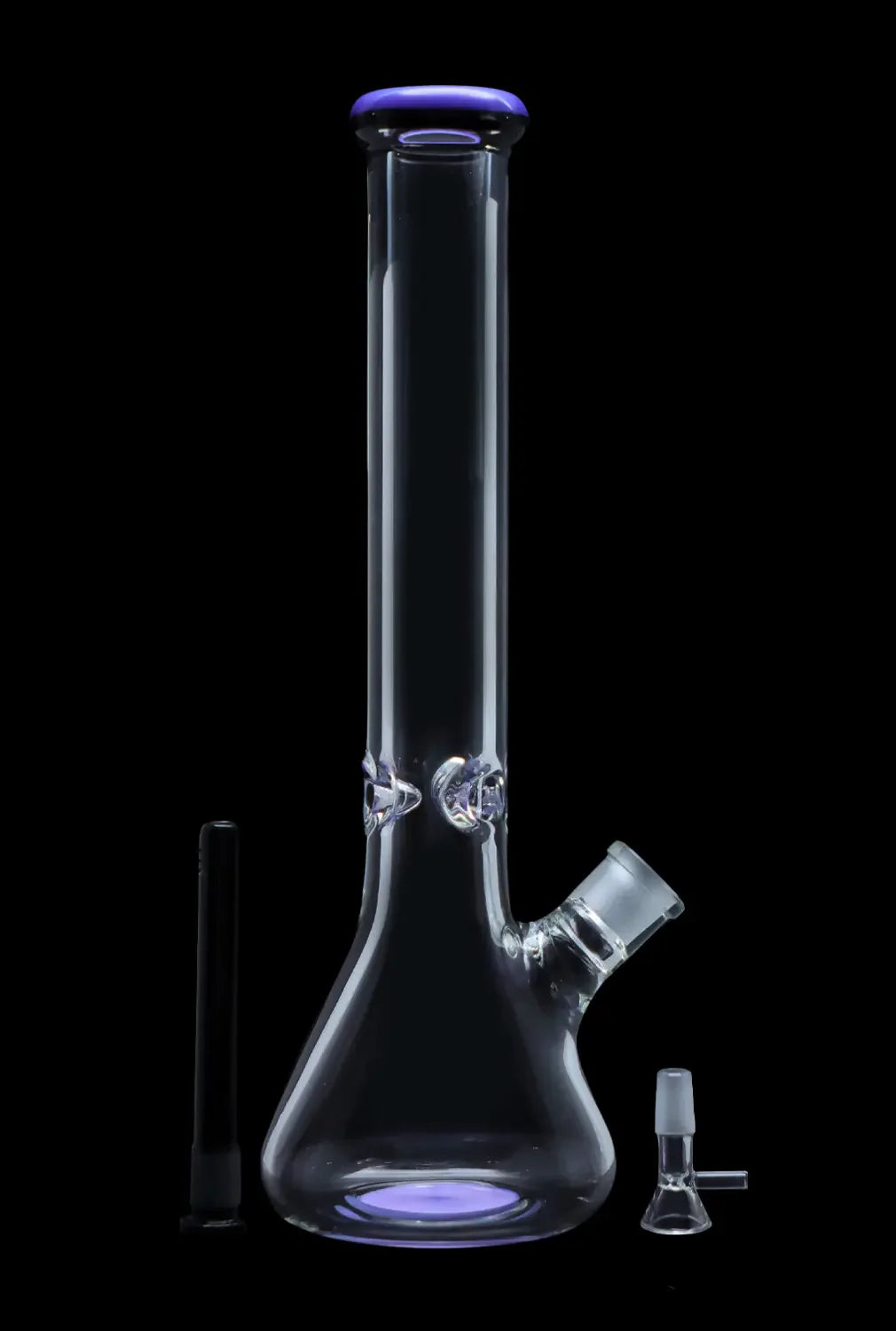Clear glass bong with a flared base and purple accents, alongside a downstem and glass tip.