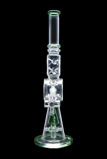 Green glass water pipe (bong) with intricate bubble and chamber design.