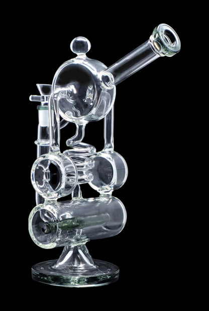 Clear glass water pipe (rig) with intricate bubbler design on a black background.