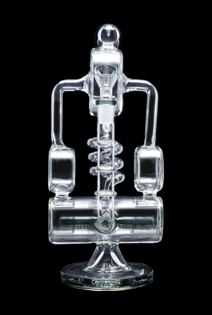 Clear glass rig with intricate bubbler design.