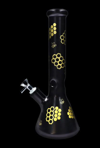 Black glass bong decorated with golden honeycomb and bee motifs.