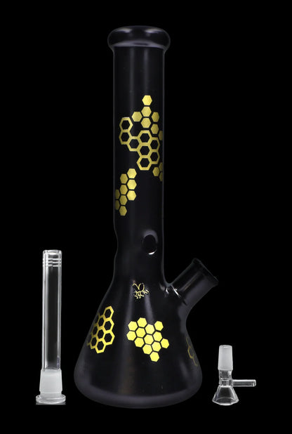 Black glass bong with gold honeycomb pattern, accompanied by a downstem and bowl.