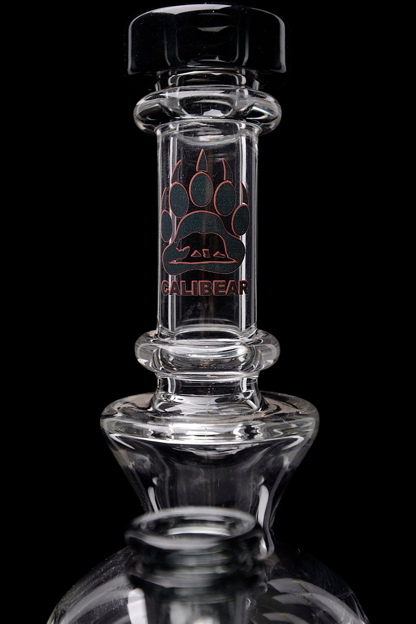 Clear glass water pipe with “Calibear” logo.