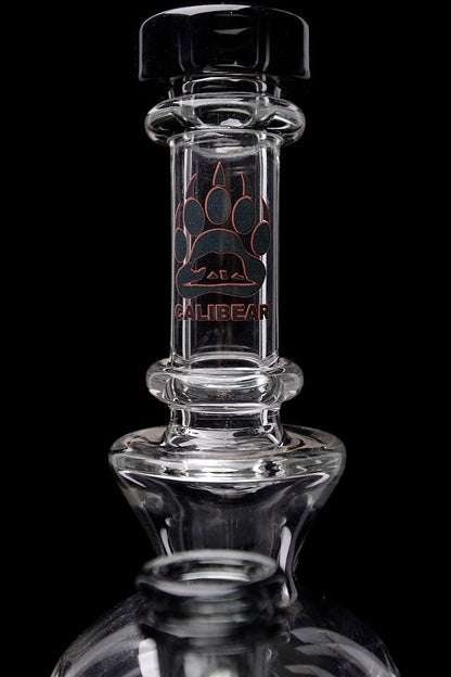 Clear glass water pipe with “Calibear” logo.