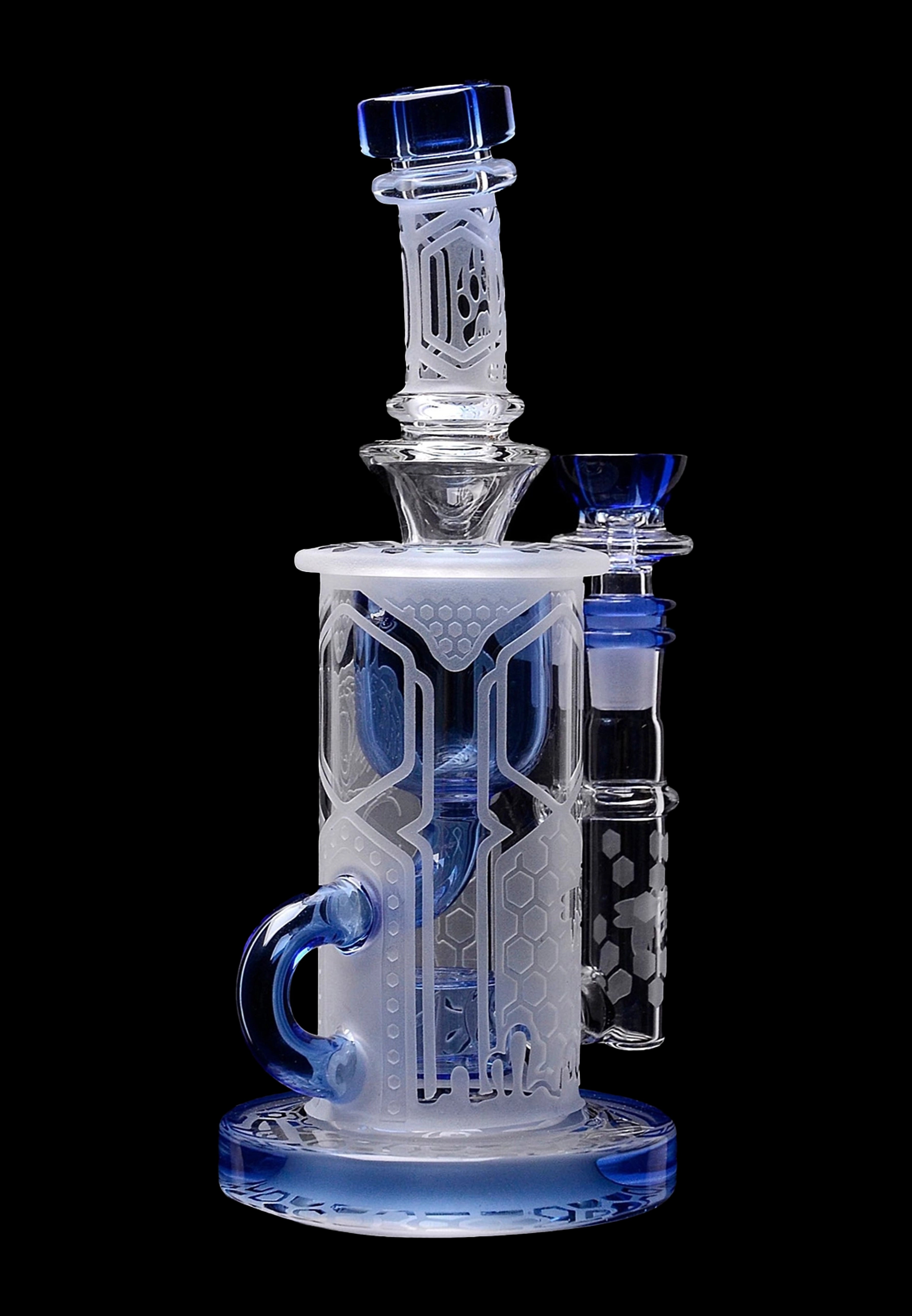 Clear glass water pipe (bong) with blue accents and intricate geometric patterns, studio shot on black background.