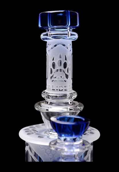 Intricate glass dab rig with blue accents, featuring a honeycomb perc and quartz banger.