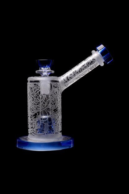 Clear glass water pipe with intricate latticework design and blue accents, isolated on a black background.