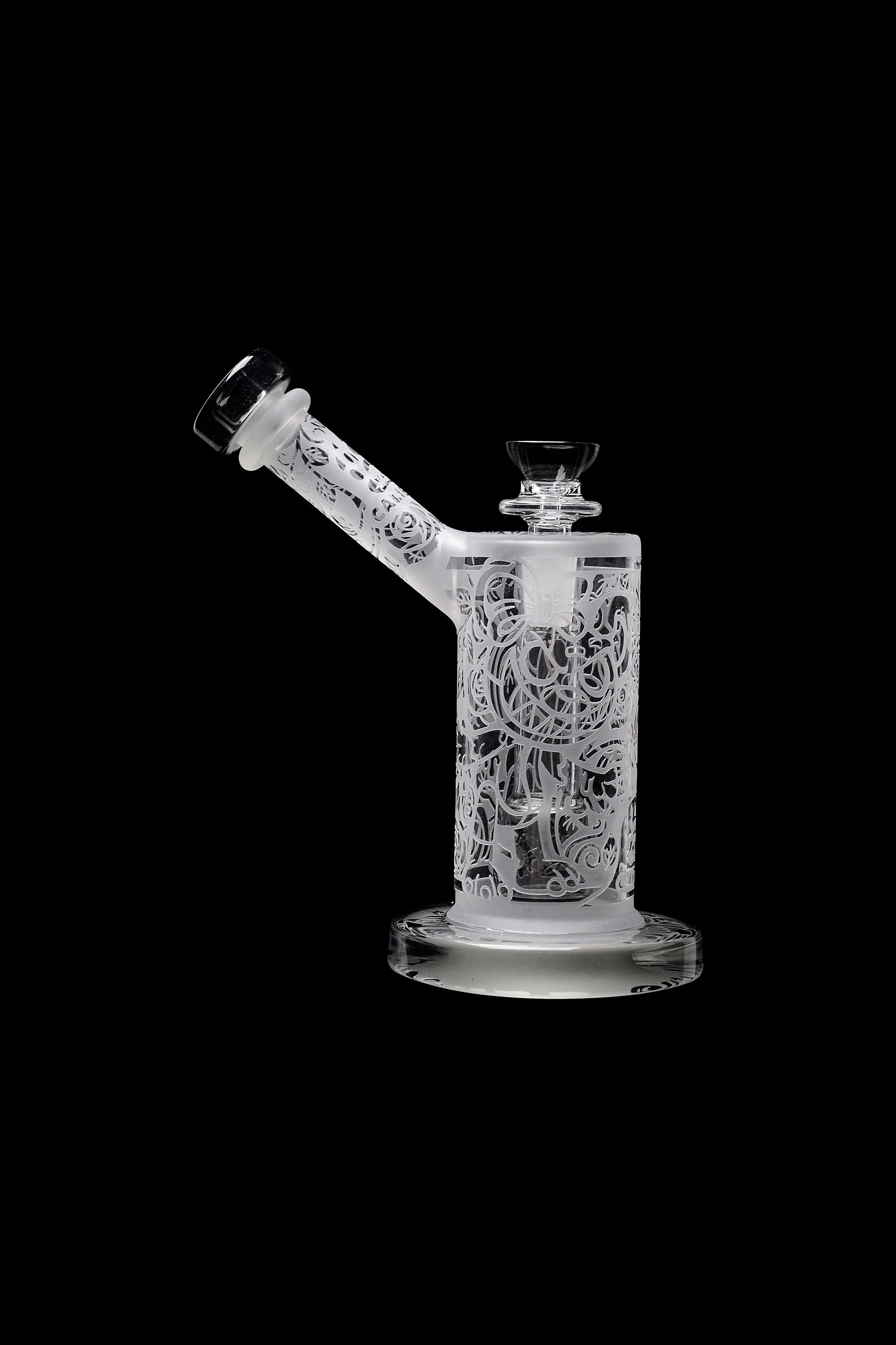 Frosted glass water pipe with intricate floral designs, studio shot on black background.