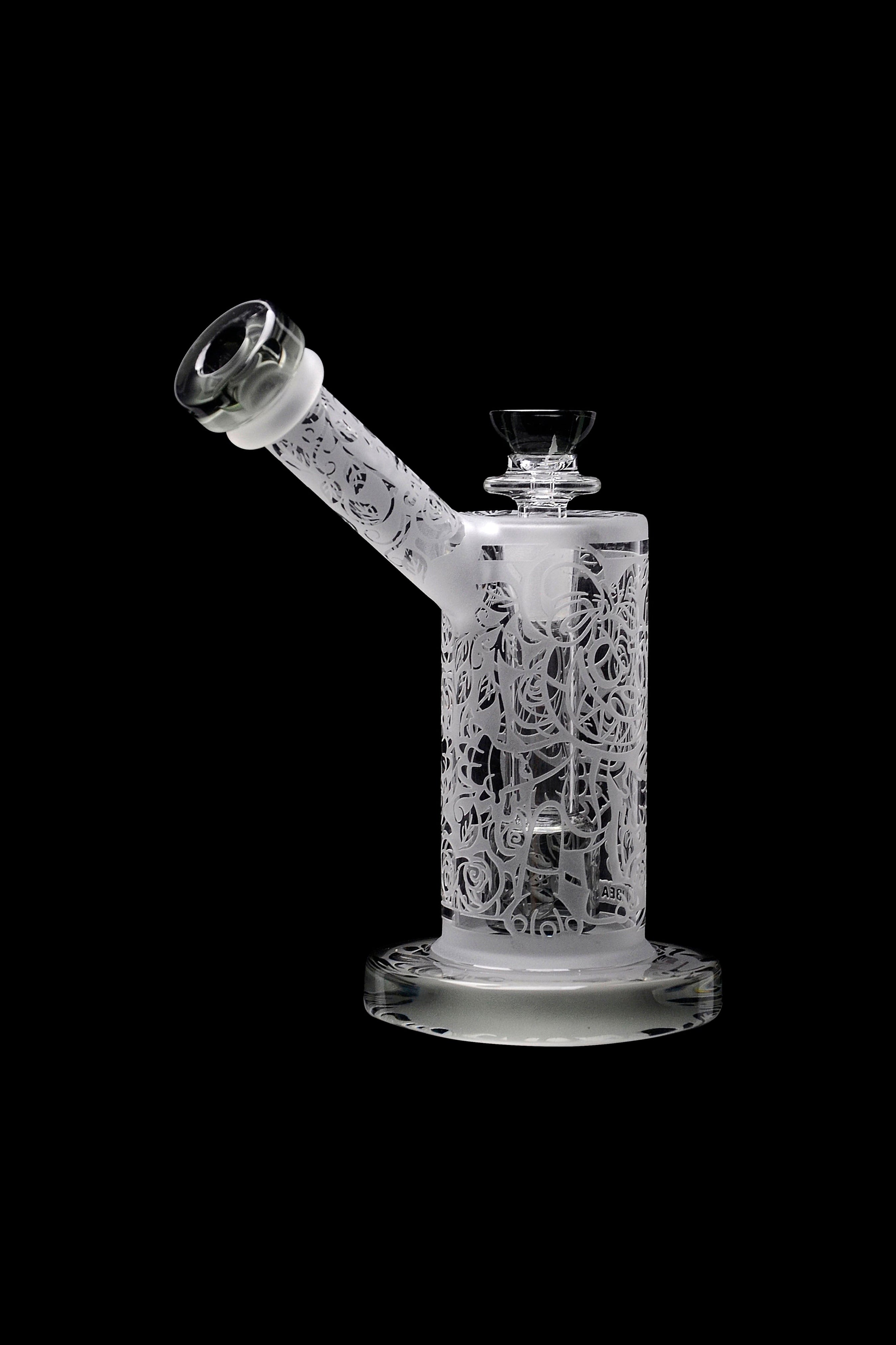 Frosted glass water pipe with sculpted skull and floral design.