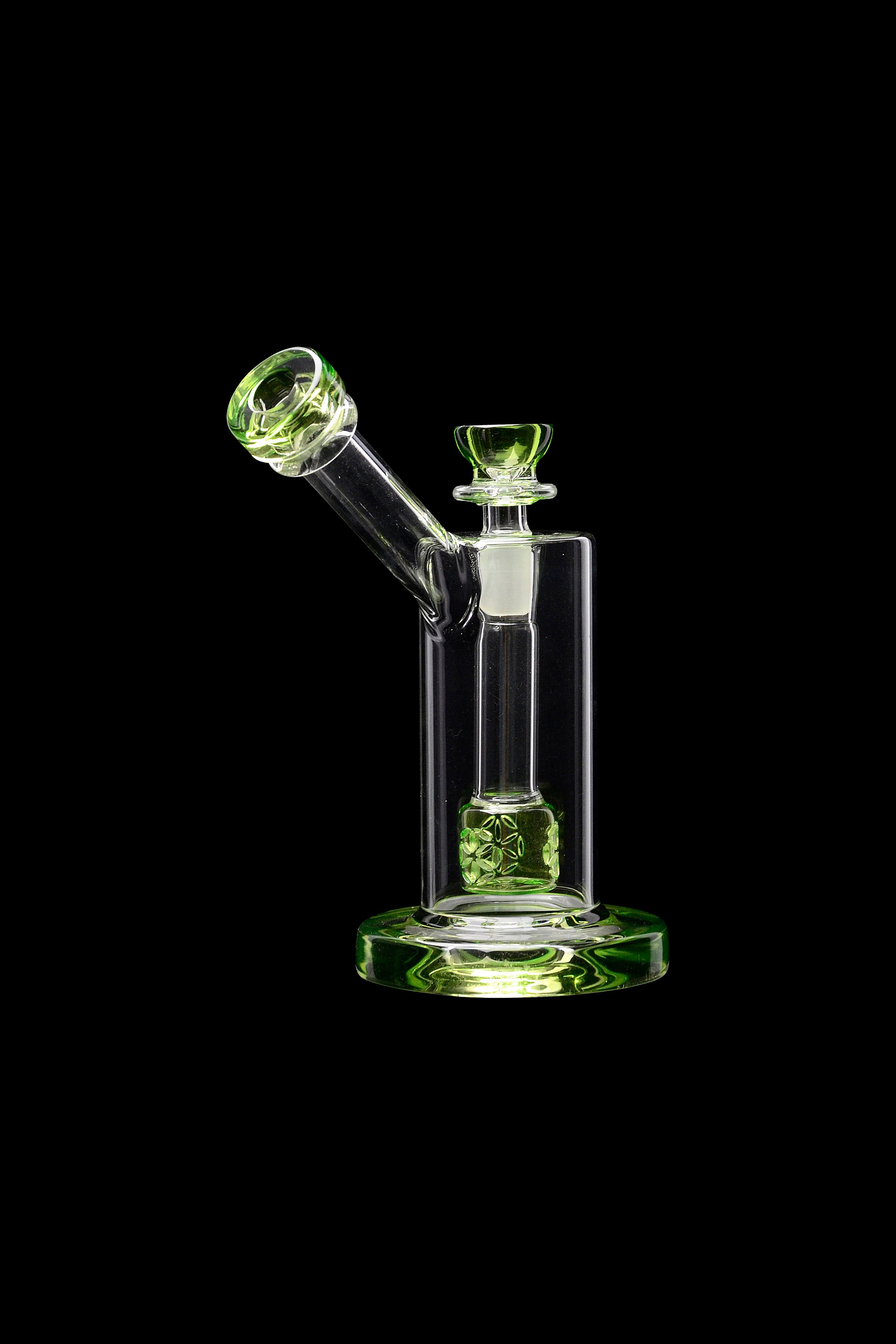 Green glass water pipe (rig) against a black background.