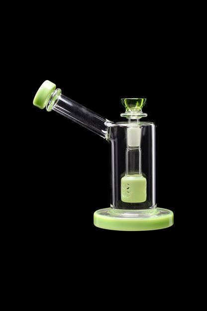 Green glass bubbler with a clear central chamber, isolated on a black background.