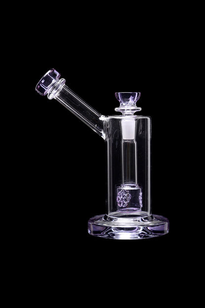 Glass water pipe (rig) with purple accents, isolated on black.
