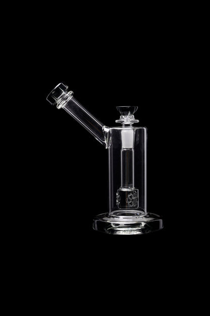 Clear glass dab rig with intricate percolator, isolated on black.