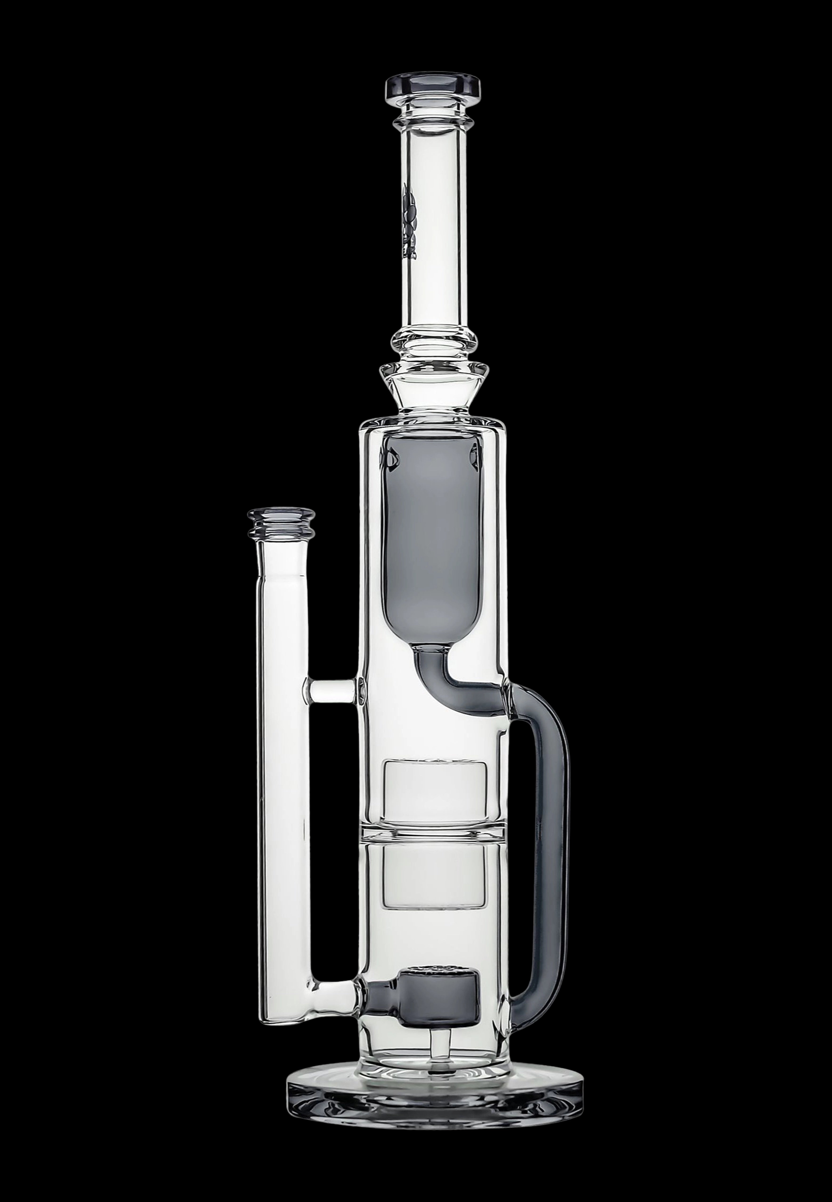 Clear glass water pipe (rig) with multiple chambers and percolators, isolated on a black background.