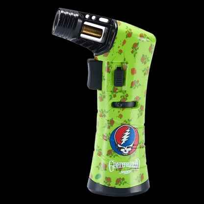 Angled close-up of the green Grateful Dead Freedom Torch with rose pattern, black nozzle, and a Grateful Dead skull logo.