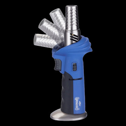 Angled close-up of the stainless tip rotating into position on the blue Grateful Dead Torch Deluxe against a black background