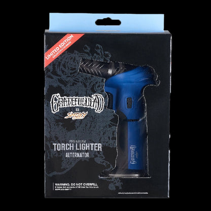 Front view of the blue Grateful Dead Torch Deluxe torch lighter visible through die-cut black packaging with a pale blue hang tab.