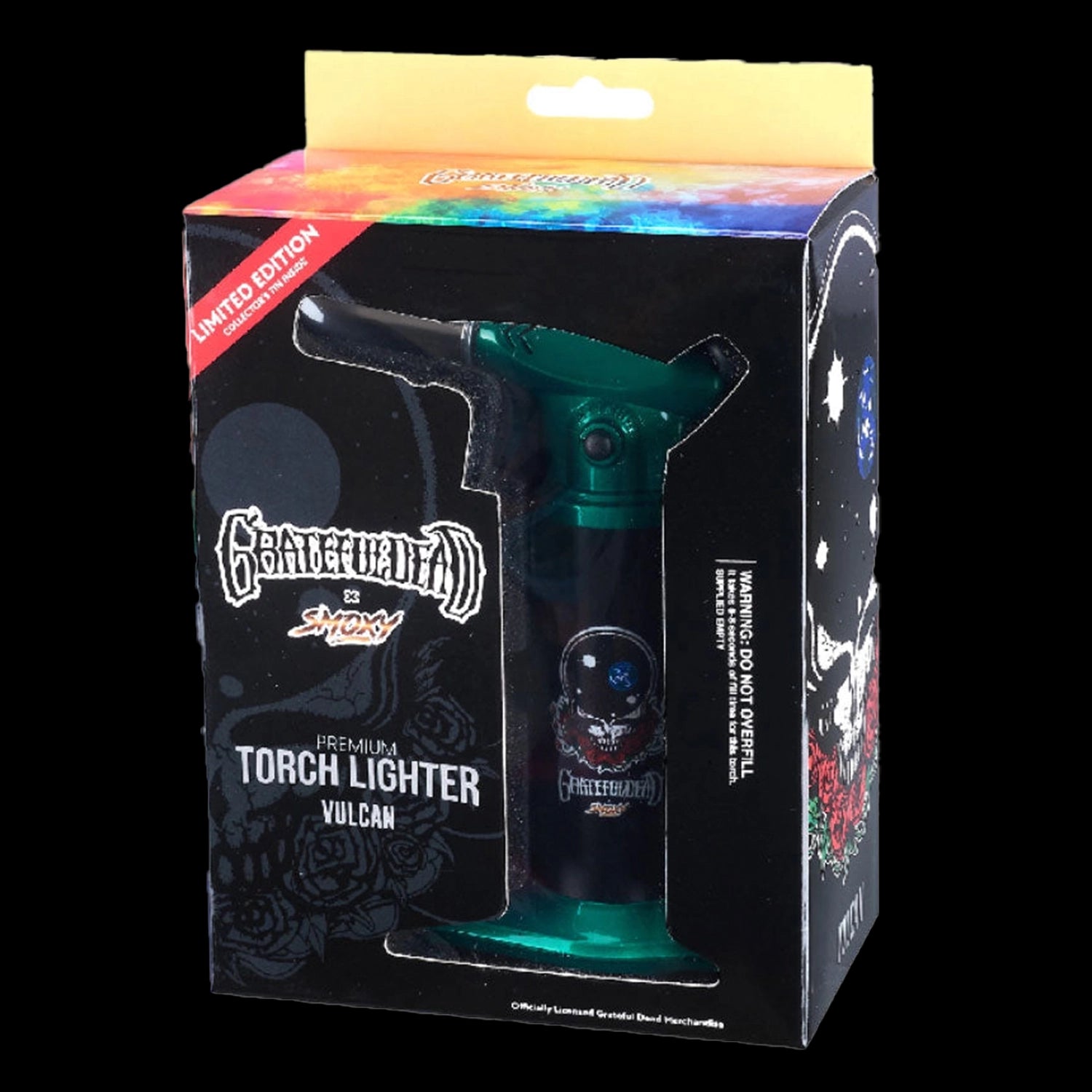 Angled front view of the boxed Grateful Dead Vulcan Torch showing its green nozzle through a die-cut window and black packaging with skull art.