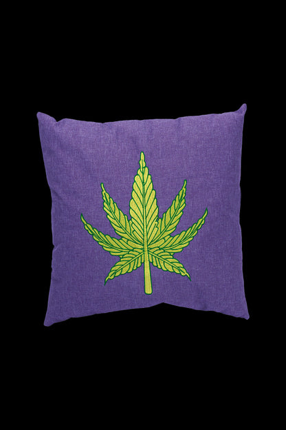 Purple throw pillow embroidered with a cannabis leaf.
