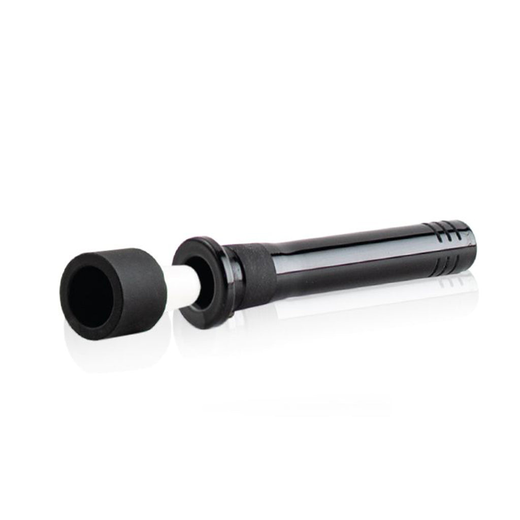 Angled close-up of the black RYOT Silicone Stem With Glass Bowl - 14MM laid on a white reflective surface with the bowl removed to show the white glass insert.