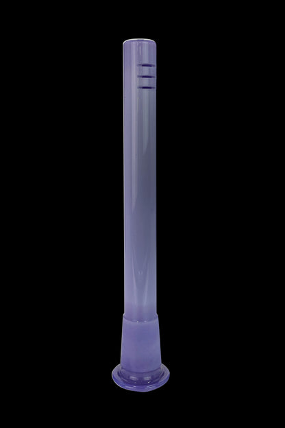 Purple glass bong isolated on a black background.