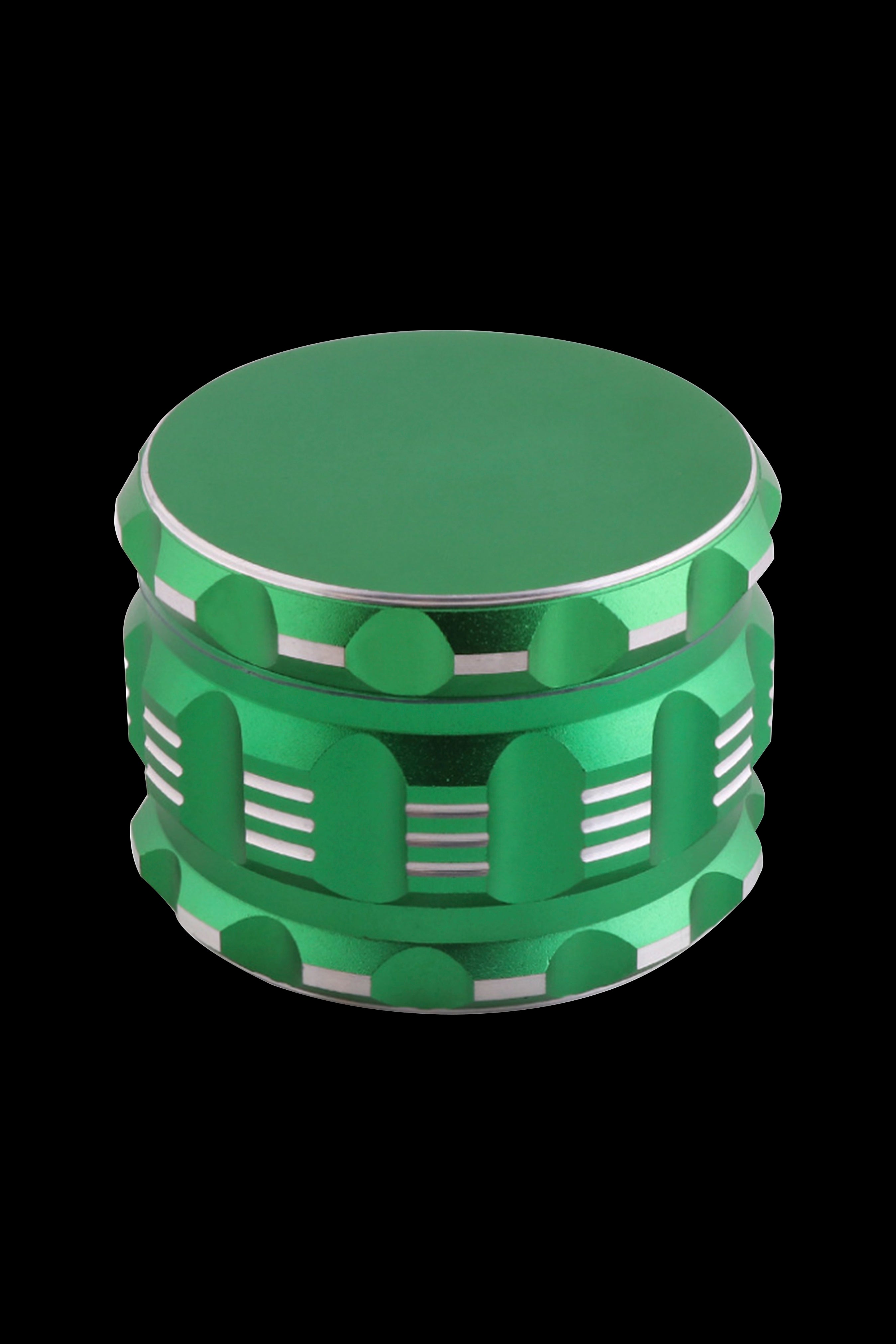Green cannabis grinder with a layered, casino-chip design.