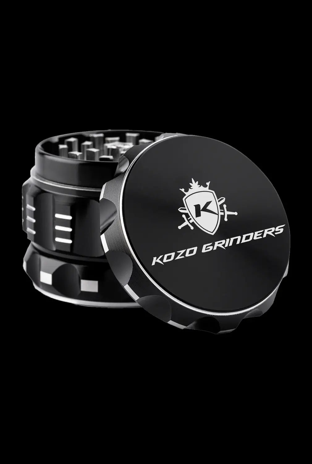 A close-up, angled view of the Kozo Grinder 2| showcasing its metallic, multi-tiered design against a dark backdrop.