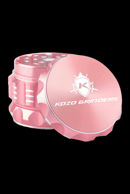 Front view of the Kozo Grinder 2| a silver metal grinder with a circular design and visible textured grip.