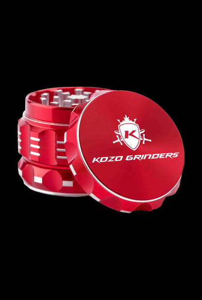 A close-up, angled view of the Kozo Grinder 2| showcasing its metallic silver finish and textured outer casing.