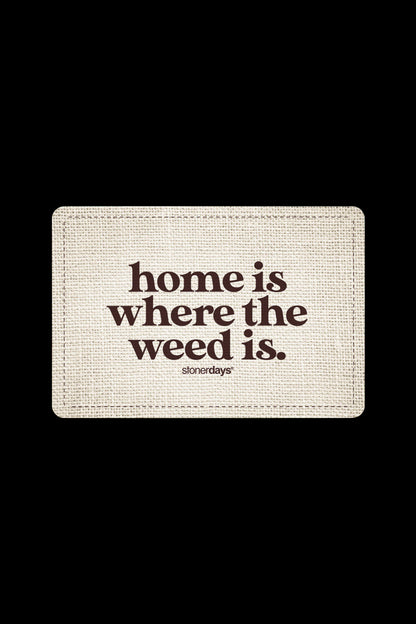 Tan textured mat with text reading "home is where the weed is." and “stonerdays” below.
