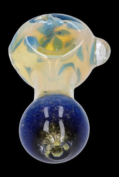 Hand-blown glass pipe with a celestial, planet-like design.