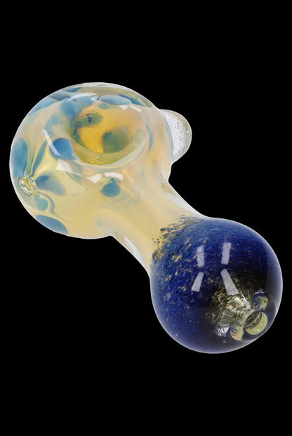 Hand-blown glass pipe with blue and yellow swirling patterns.