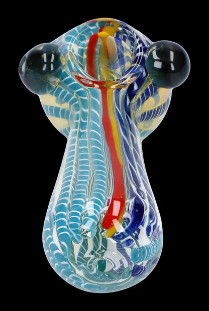 Hand-blown glass water pipe with intricate blue, red, and white swirling patterns.
