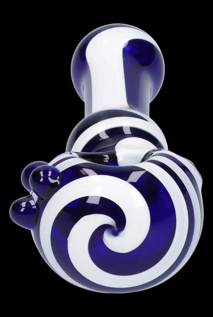 Blue and white glass cannabis oil rig with swirling pattern.