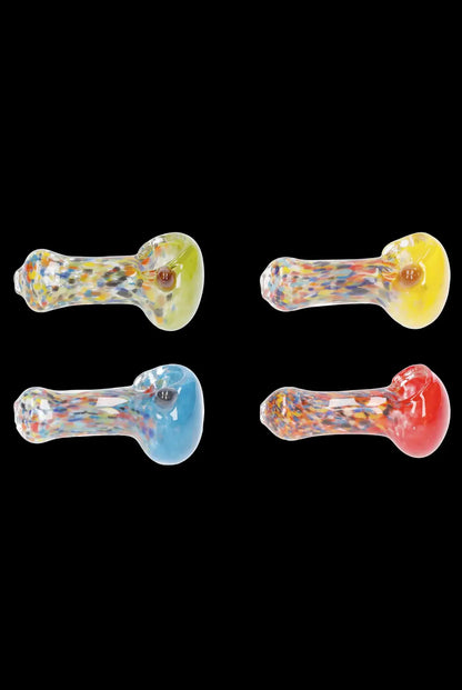Four colorful glass smoking pipes against a black background.