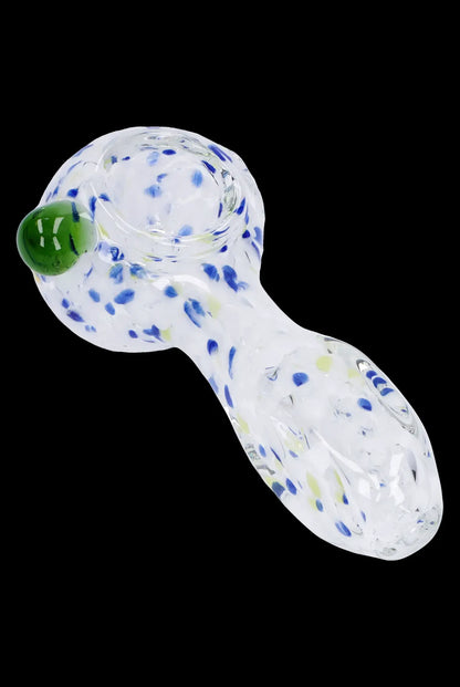 Glass cannabis pipe with speckled white and blue pattern.