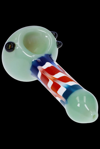 Glass pipe with red, white, and blue striped stem.
