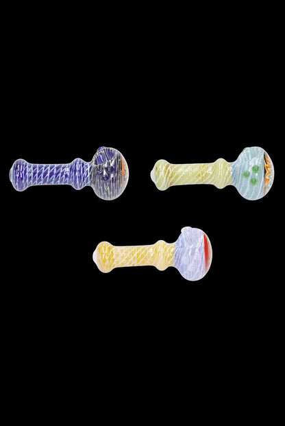Colorful glass pipes arranged on a black background.