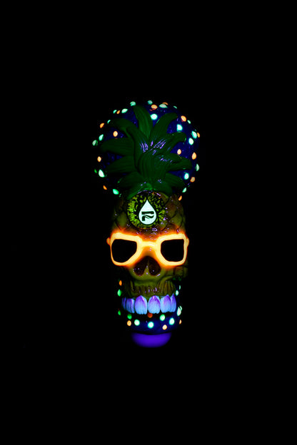 Neon-lit skull with cannabis leaf crown against a black background.